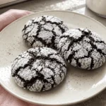 Freshly baked chocolate crinkle cookies coated in powdered sugar